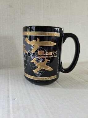 Vintage Learjet Aircraft Coffee Mug Black Gold Lion Marketing 12 oz Aerospace